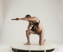 Man Adult Muscular White Fighting with gun Kneeling poses Underwear
